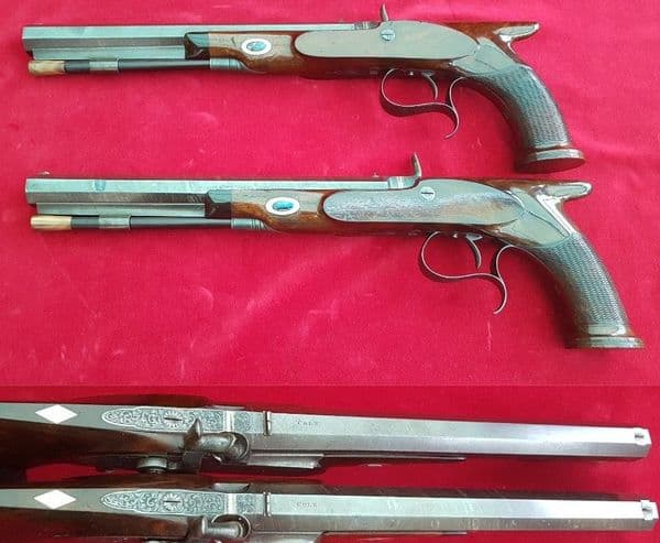 A cased pair of saw-handled Percussion Duelling pistols by COLE superb condition. FOR SALE. Ref 1674